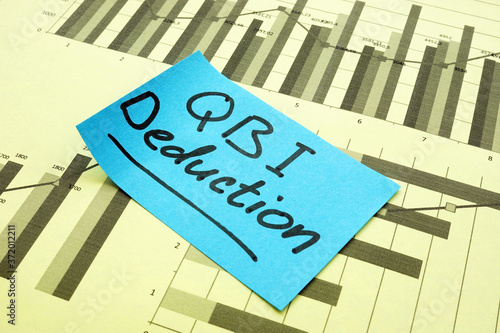 Qualified Business Income QBI Deduction memo on the business charts.
