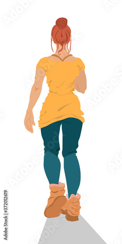 Red head woman in blue leggings, brown boots and yellow t-shirt running. Back...