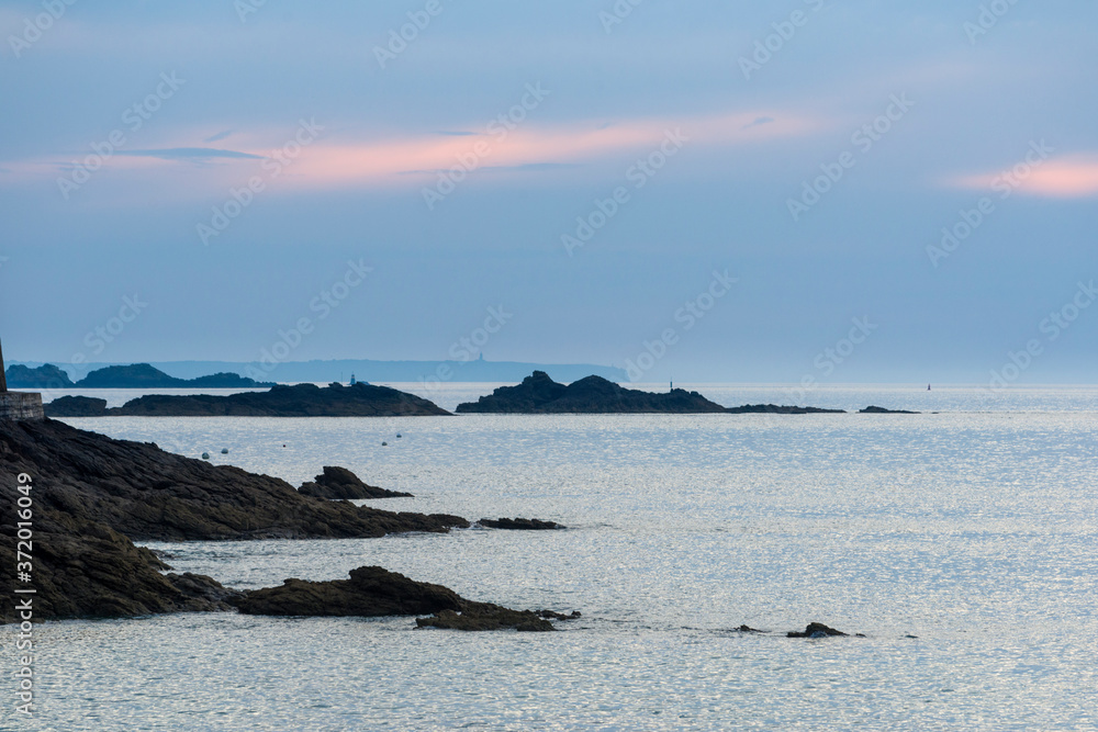 sunset at Saint-Enogat beach and rocks in Dinard in Brittany, France