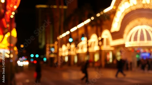 Defocused fabulous Las Vegas Strip boulevard, luxury casino and hotel, gambling area in Nevada, USA. Nightlife and traffic near Fremont street in tourist money playing resort. Neon lights of sin city.