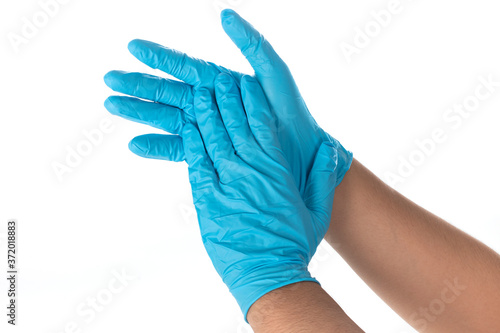 Doctors wear blue nitrile rubber gloves separately on a white background. photo