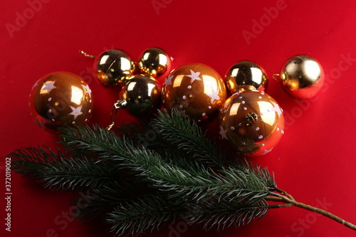 Christmas golden balls on red background
