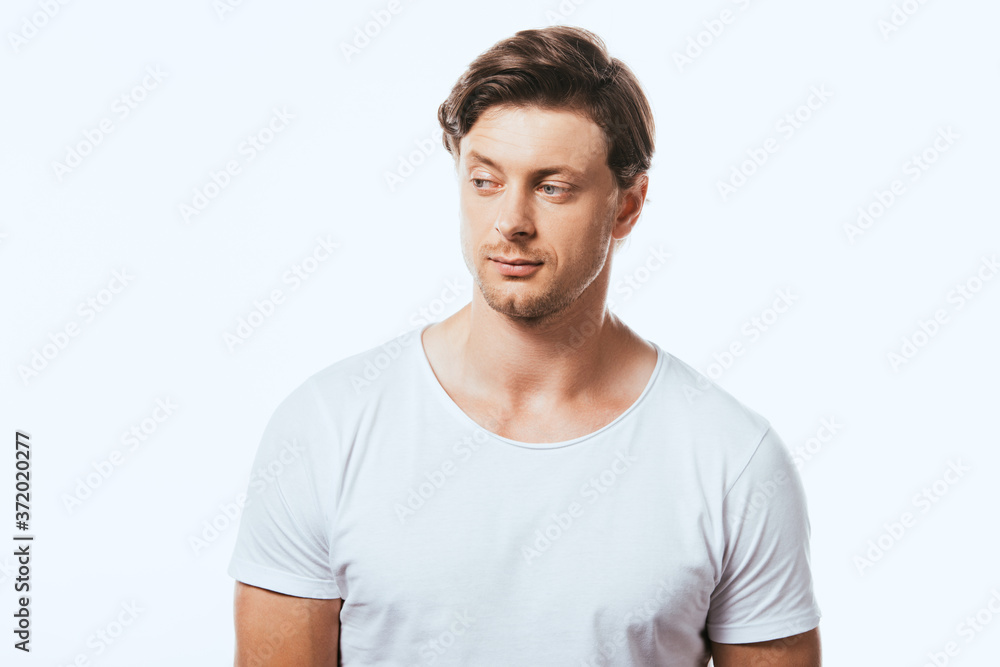 Confident man in white t-shirt looking away isolated on white Confident man in white t-shirt looking away isolated on white