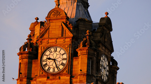 Sunset photo of the Balmoral Clock Tower in Edinburgh Scotland in the summer  photo