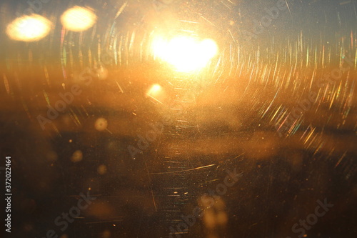 Morning sun rays and airplane window