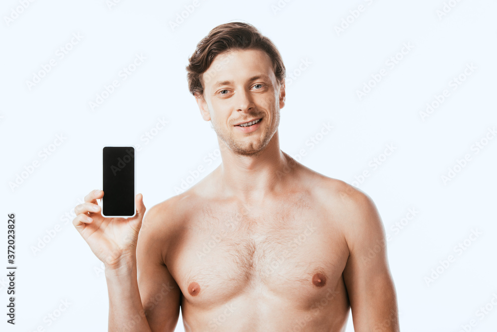 Fototapeta premium Shirtless man showing smartphone isolated on white