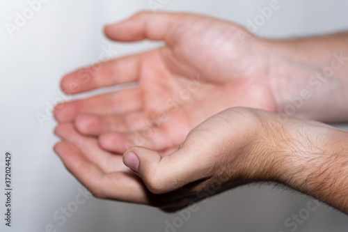 Young Man Holding Out Clean Hands 