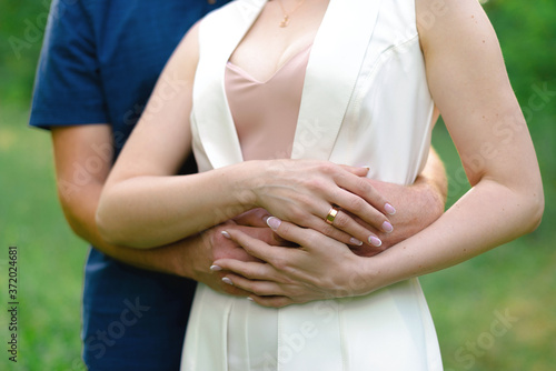 bride and groom holding hands