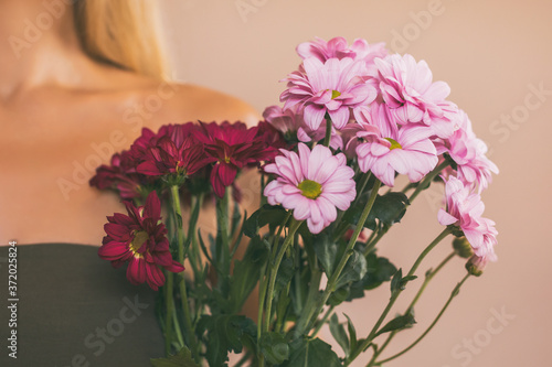 Wallpaper Mural Woman holding beautiful bouquet of flowers.Focus on flowers. Torontodigital.ca