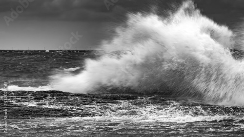 Waves breaking coastal rocks