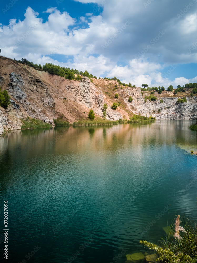 Views of the natural area called Pelag Gran de Vilobí, in Catalonia where you can see the water and the reflection of the mountain on a sunny day