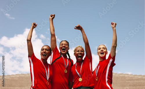 Fototapeta Naklejka Na Ścianę i Meble -  Professional female soccer players celebrating a victory