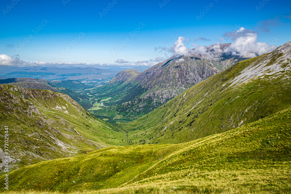 Fototapeta premium View down Glen Nevis from Stob Ban, Mamores, Scotland. Beautiful Scottish HIghlands summer landscape.