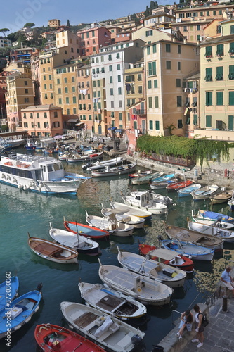 The characteristic seaside village of Camogli in the eastern Ligurian Riviera located between Recco and Rapallo. The heart of the town is in its characteristic porticcilo full of fishing boats and ple