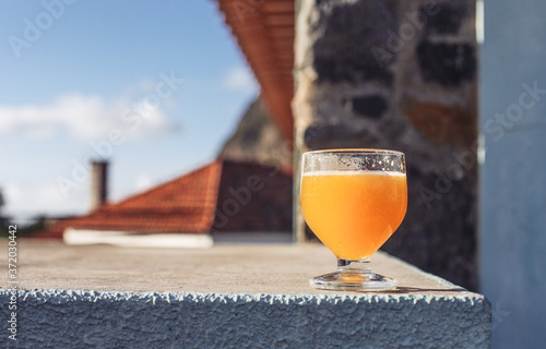 Wallpaper Mural A glass of yellow drink - traditional alcoholic orange drink from Madeira - poncha Torontodigital.ca