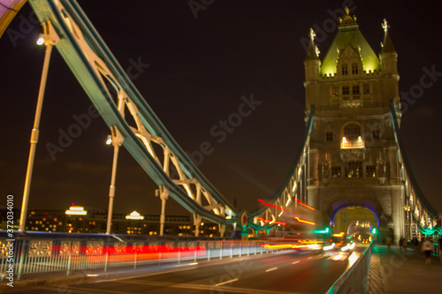 Fototapeta Naklejka Na Ścianę i Meble -  Tower Bridge cars passing in time-lapse at night