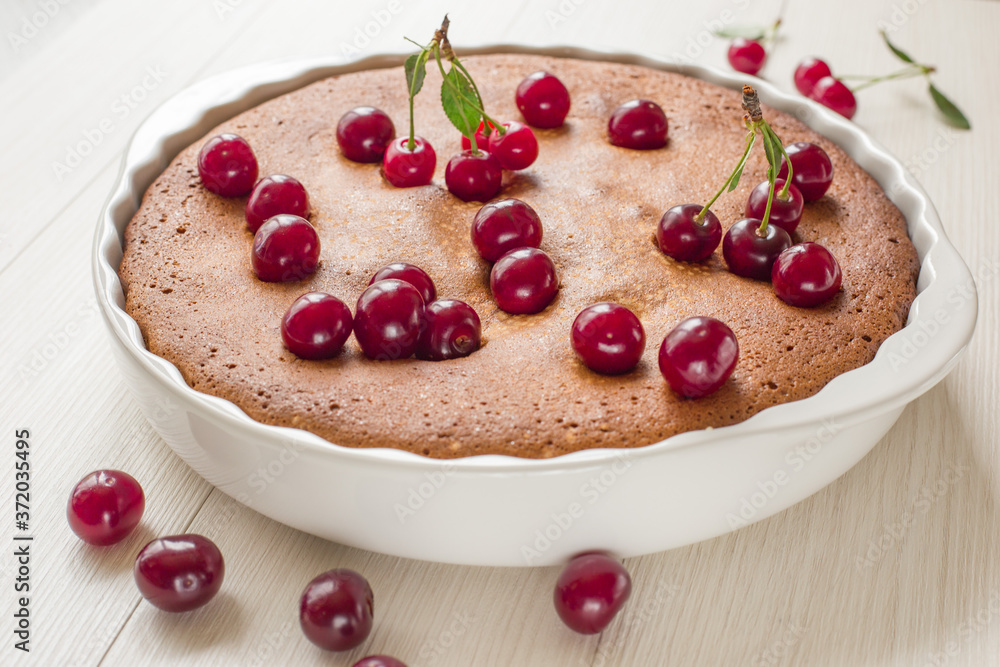 Freshly baked cherry pie on light wood background. Still life. Freshly baked cherry pie on light wood background. Still life.