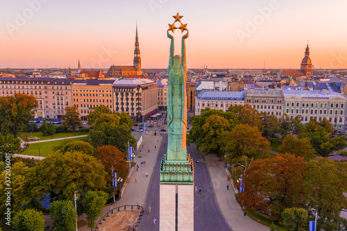 Amazing Aerial View of the Statue of Liberty Milda in Riga, Latvia during sunset. photo