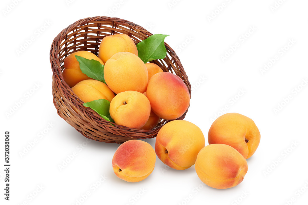 apricot fruit in Wicker basket isolated on white background. Clipping path and full depth of field