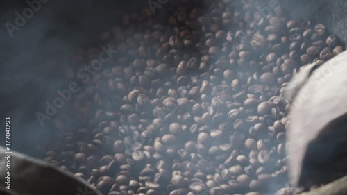 Traditional Indonesian Coffee Making Production Process in Labuan Bajo Flores Indonesia - Green Beans, Roasting, Mashed, Sieving in Slow Motion photo