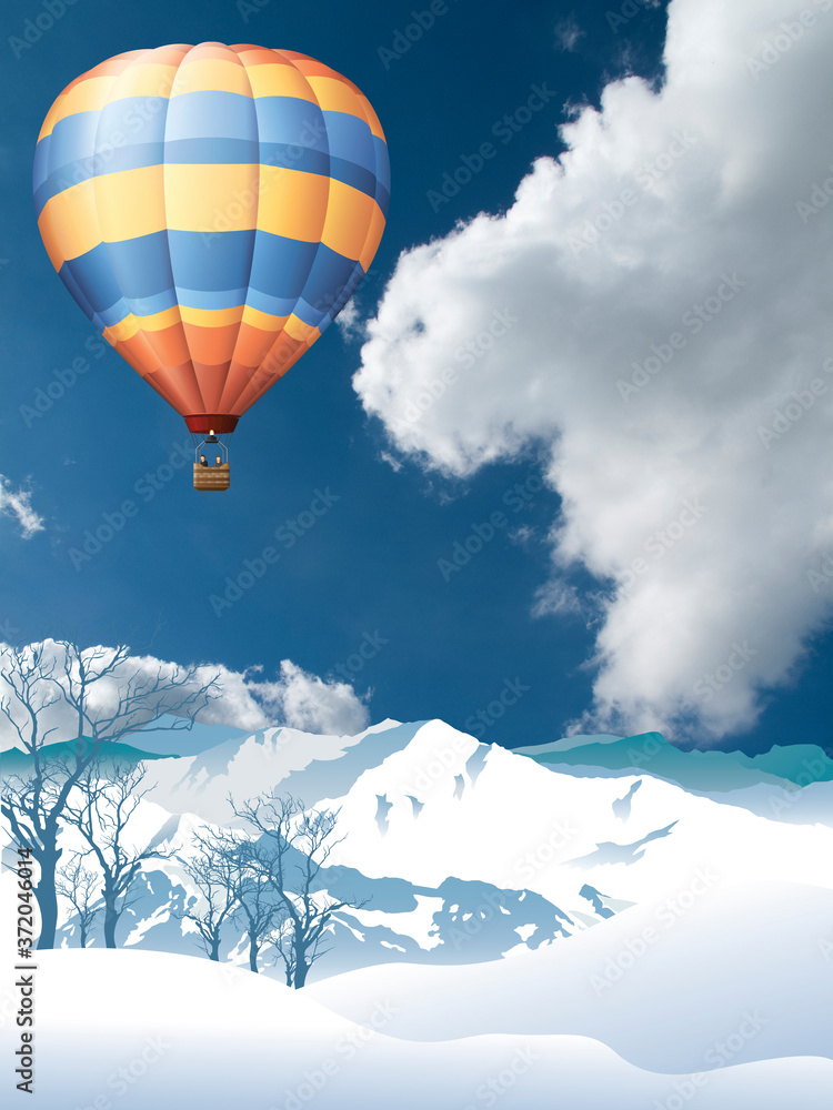 Picturesque rural snow covered winter mountain scene with hot air balloon set against a cloudy blue sky Picturesque rural snow covered winter mountain scene with hot air balloon set against a cloudy blue sky