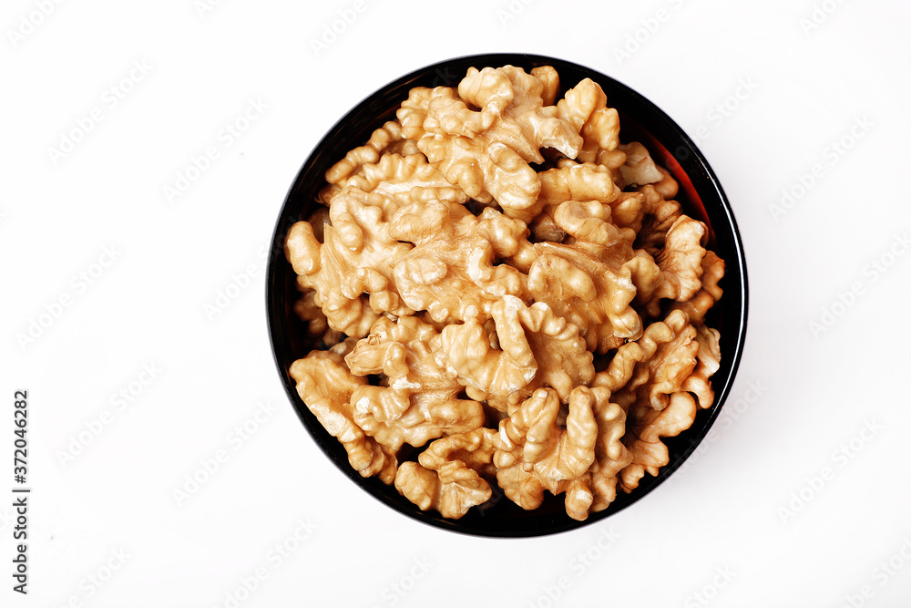 Walnut In Bowl Isolated On White Background. Walnut In Bowl Isolated On White Background.