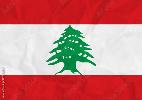 A distressed red white and green Lebanese flag illustration with crumpled paper texture