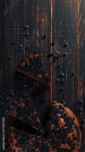 Blueberry pie with berries, homemade fresh pastries, on a wooden background. Copy space.