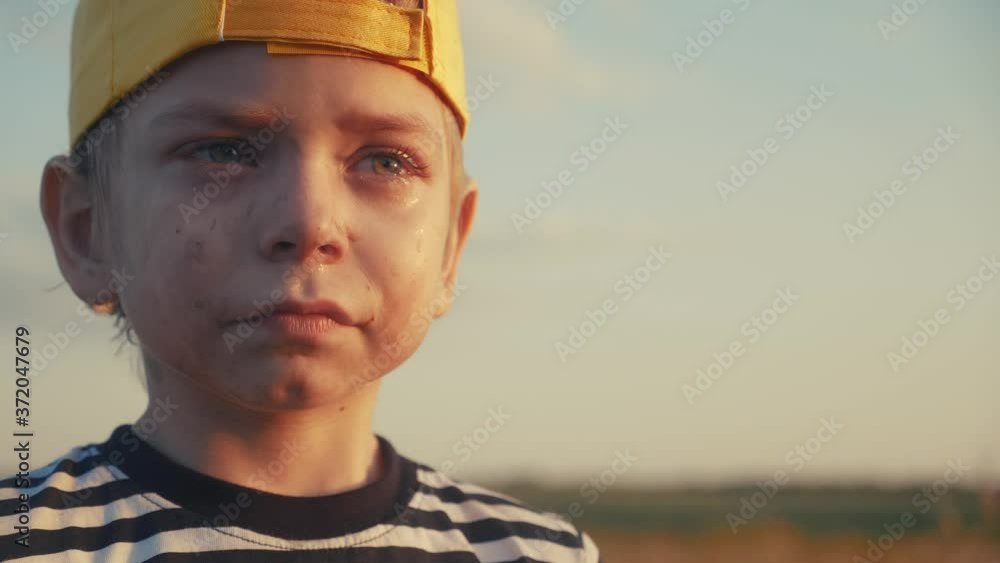 boy kid crying flowing tears a screaming dirty face. child lifestyle son scream disappointed cranky. domestic violence concept. close-up toddler roared all in tears boy kid crying flowing tears a screaming dirty face. child lifestyle son scream disappointed cranky. domestic violence concept. close-up toddler roared all in tears