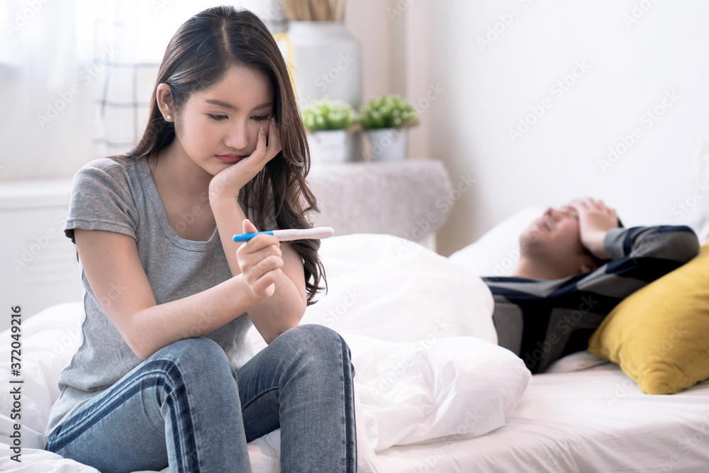 Asian women feel stressed after getting a pregnancy test, She was not ready to have children. Asian women feel stressed after getting a pregnancy test, She was not ready to have children.