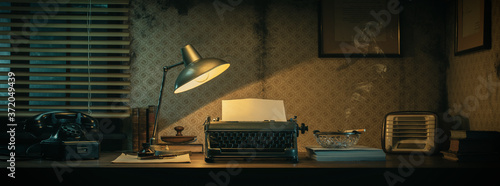 Vintage film noir office desk with old typewriter photo