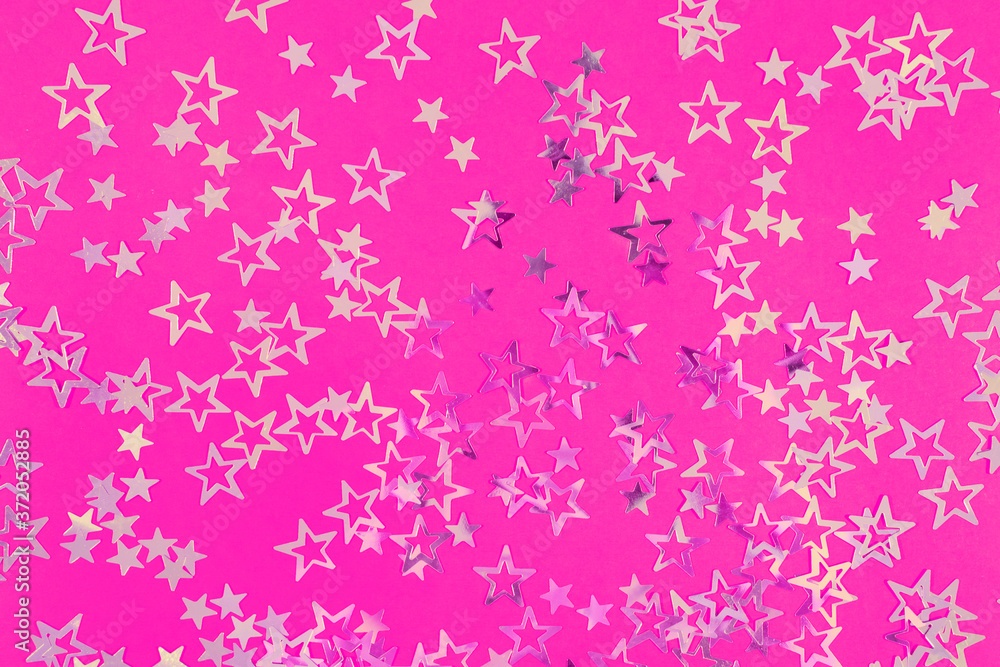 Golden sparkling stars on neon pink background, festive or holiday concept. Beautiful abstract backdrop for your blog or project Golden sparkling stars on neon pink background, festive or holiday concept. Beautiful abstract backdrop for your blog or project