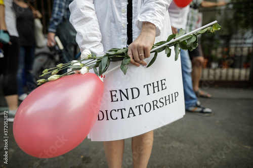 Details with a banner held by a woman during a political rally supporting the protests in Belarus. photo