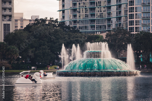 The lake Eola fountain in downtown orlando florida in central florida Lake Eola Park is located in the heart of Downtown Orlando, with a sidewalk that circles the lake .9 miles in length