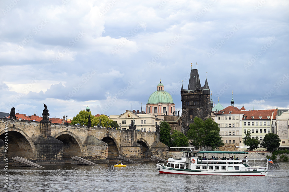Charles bridge over Vltava river Prague riverside