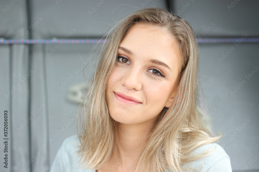 Portrait of the smiling young beautiful woman with blonde hair, happy pretty teenage girl Portrait of the smiling young beautiful woman with blonde hair, happy pretty teenage girl