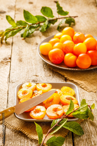 fresh organic cherry plums on wooden background