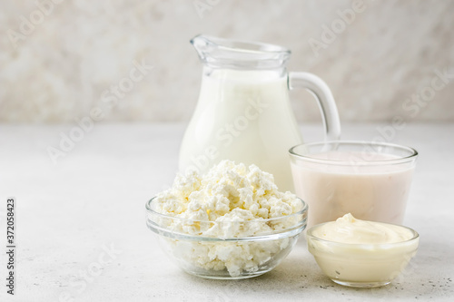 Dairy products, milk, yogurt, cottage cheese, cheese sauce. Copy space.