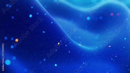 fantastical festive blue bg. Stylish abstract looped background, waves move on matt surface like landscape made of liquid blue wax with sparkles. Beautiful soft background with smooth animation 4k photo