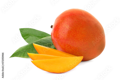 Whole and cut ripe mangoes isolated on white. Exotic fruit