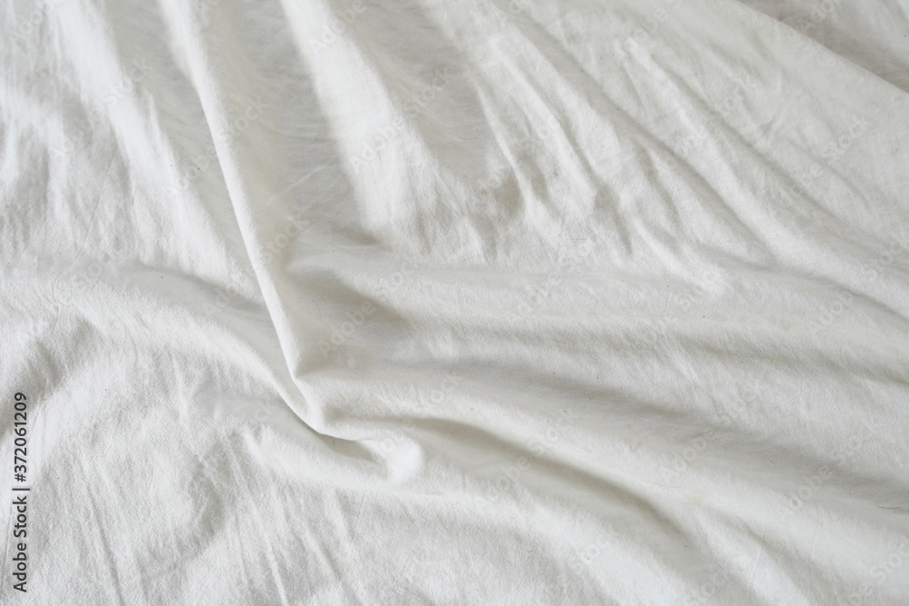 weißes Bettlacken mit Textur als Hintergrund 