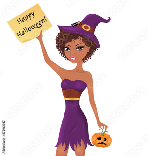 Cute afro-american witch holding a piece of paper with happy halloween text. photo