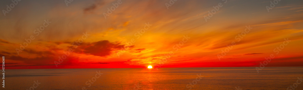 Beautiful Orange and Yellow Golden Hour Sunset over the Ocean