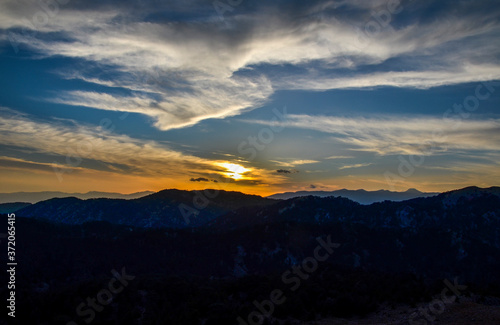 Panoramic view of the mountain landscape at sunset. Mountain silhouettes. View from Mount Tahtali near Kemer to Taurus Mountains  Turkey