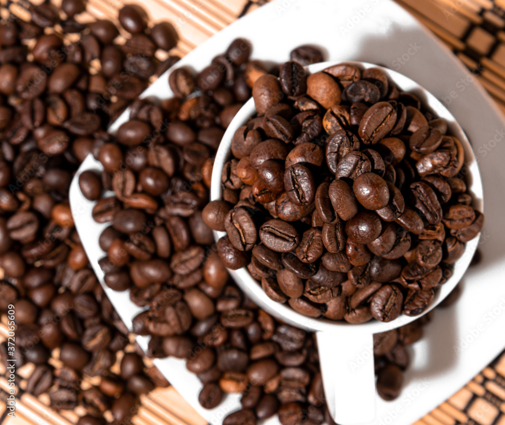 Fototapeta premium white cup full of coffee beans