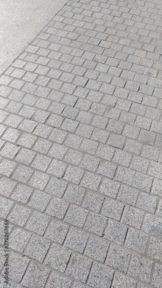 Fragment of the pavement, finished with graceful polished stone