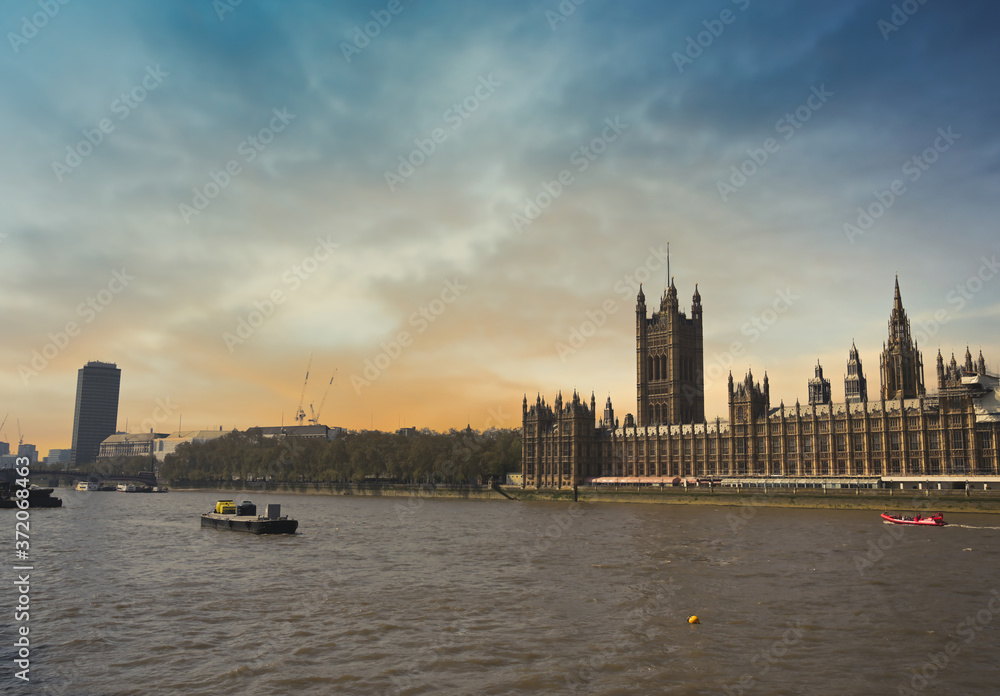 The Palace of Westminster along the banks of the Thames in central London, UK. The Palace of Westminster along the banks of the Thames in central London, UK.
