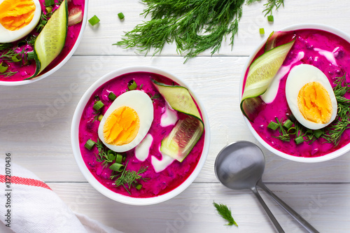 Cold summer soup from fresh young beetroot and cucumbers with kefir with egg photo