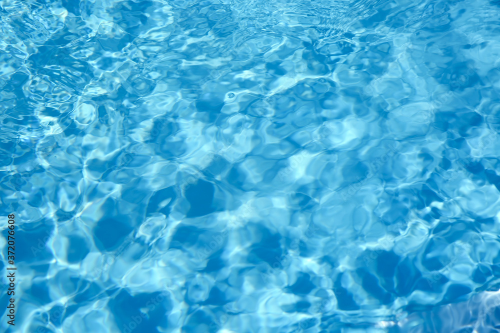 Texture of blue water in swimming pool as background, closeup Texture of blue water in swimming pool as background, closeup