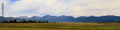 Nature panoramic of prairie and mountains